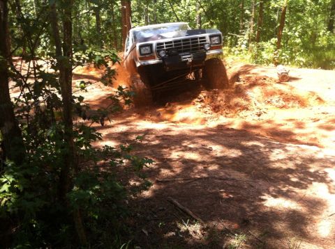 1979 Ford F-150 - This 1979 Ford F-150 navigates a muddy trail, its off-road capabilities.
