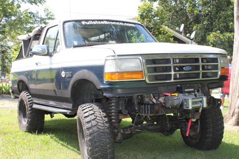 1994 Ford Bronco - This lifted Ford Bronco features a winch and custom front bumper modifications.