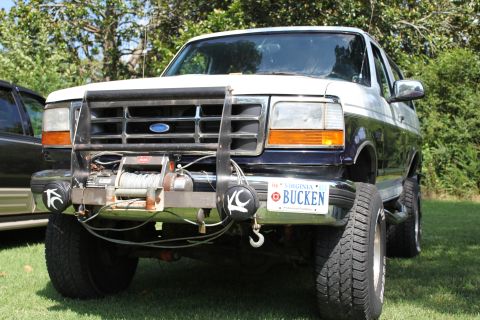 1994 Ford Bronco - This Ford Bronco features a winch and brush guard, with a custom Virginia license plate.