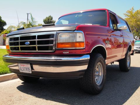 1994 Ford Bronco - This 1994 Ford Bronco features a prominent grille and chrome bumper.