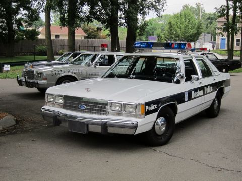 1991 Ford LTD Crown Victoria - white-and-black Boston Police Ford sedan in front three-quarter view with a silver State Police car parked behind it.