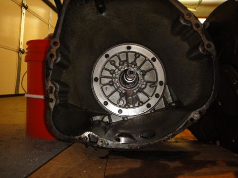 1994 Ford Bronco - Close-up of a transmission torque converter, showing its internal fin structure and mounting bolts.