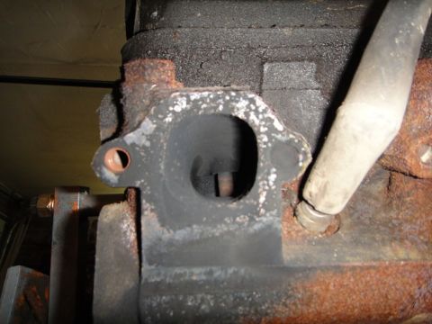 1994 Ford Bronco - Engine block exhaust port shows signs of wear and carbon deposits.