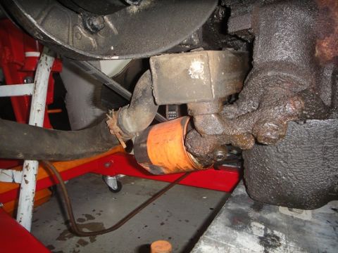 1994 Ford Bronco - This image shows an oil filter and surrounding engine components, likely during maintenance or after maintenance.