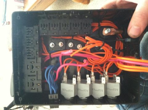 1991 Ford F-250 - Open fuse box with many wires and electrical components visible.
