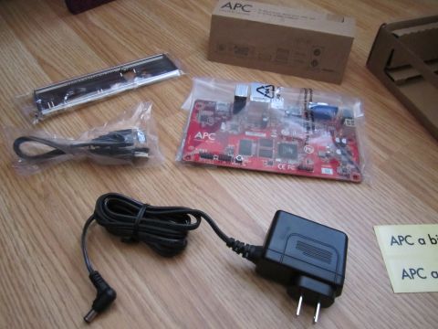 1963 Ford Falcon - Electronic components and accessories are laid out on a wooden surface.