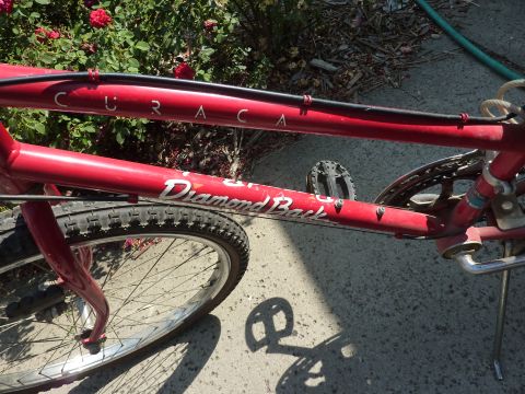 1900 Yugo GVX - Close-up of a red Diamondback bicycle frame, showing the 'CURACA' and 'Diamond Back' branding.