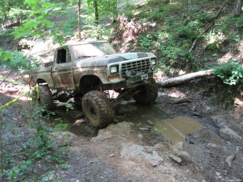 1979 Ford F-150 - This modified 1979 Ford F-150 is tackling a challenging muddy off-road course.