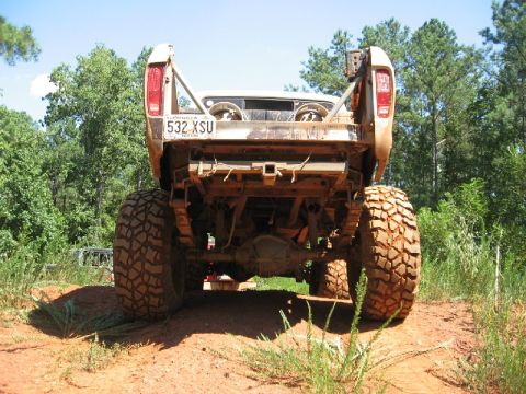 1979 Ford F-150 - This lifted 1979 Ford F-150, seen from the rear, features oversized off-road tires and a Georgia license plate.