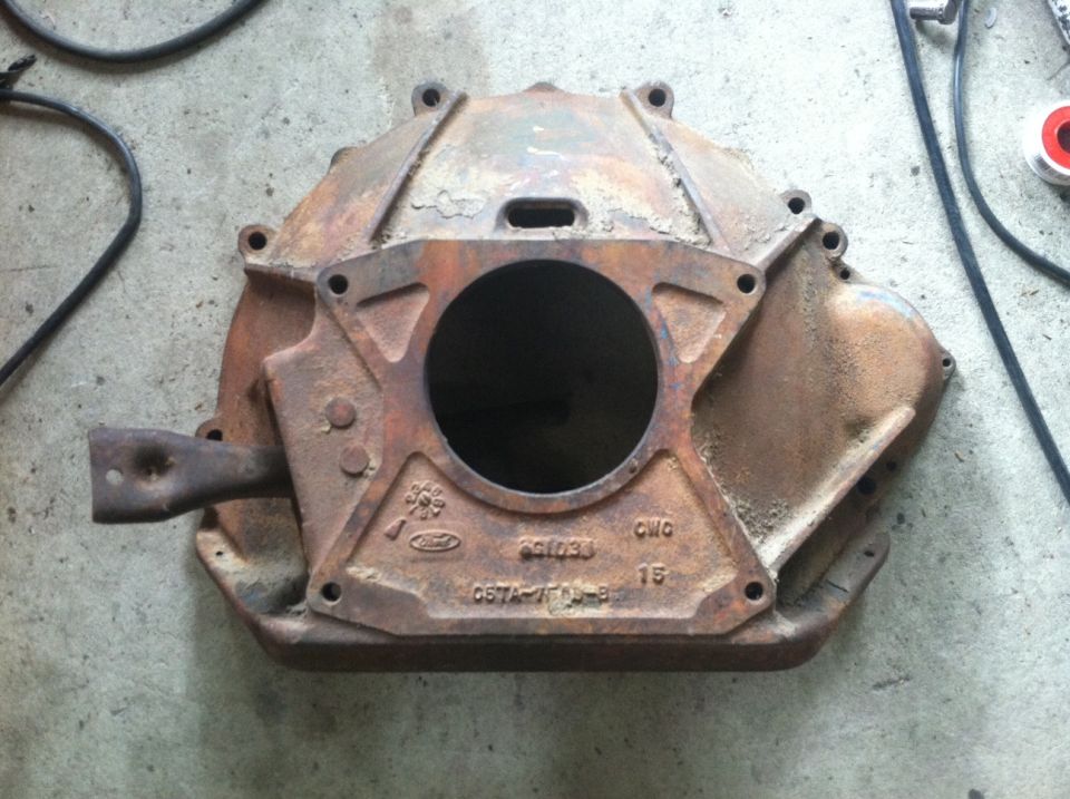 C5TA-7505-B (FE truck bell housing) 

Will work with a small block top loader and an FE in a car.
Will work with a TKO and an FE in a car.
Will work with a big block top loader and an FE in a car, but a special pilot bushing is needed. (The bell is .625 too deep.)
This bell allows use of bigger clutch in cars.