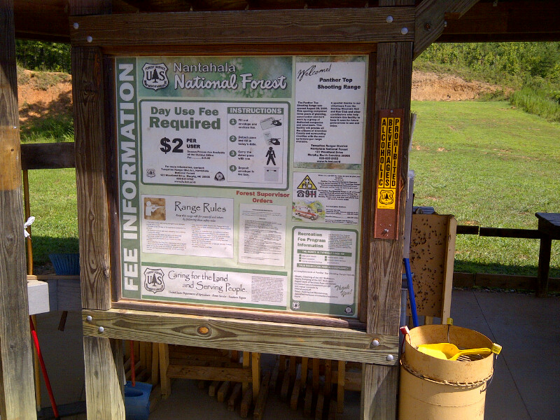 Information board at Nantahala National Forest Panther Top Shooting Range with fee and rules posted