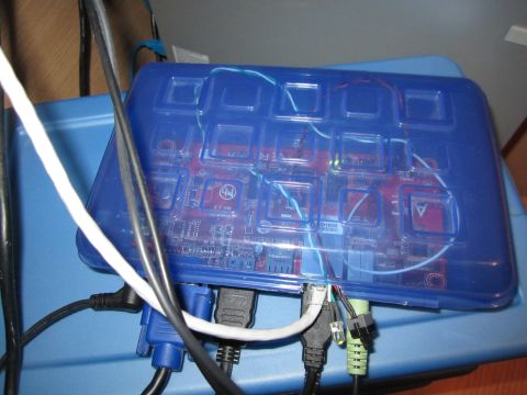 1963 Ford Falcon - A custom-built electronic device with a transparent blue casing, revealing its internal components and wiring.
