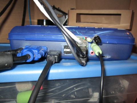 1963 Ford Falcon - A blue electronic device is connected to various cables, including VGA and USB ports.