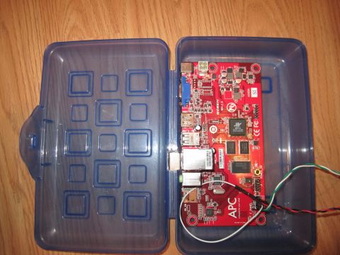 1963 Ford Falcon - An APC circuit board, likely a computer component, is housed within a blue plastic case with a grid of square indentations.