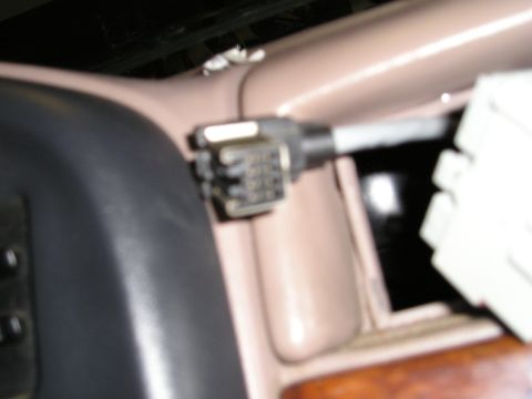 1996 Ford Bronco - Close-up view of an interior wiring harness connector, likely for an aftermarket installation.
