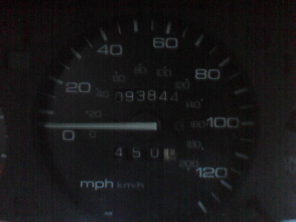 Car odometer showing 093844 miles and a speed of 0 mph