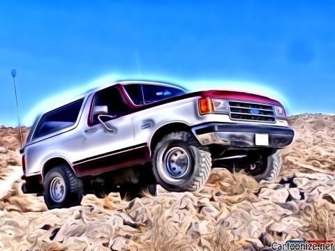 1990 Ford Bronco - 1990 Ford Bronco navigates a rough, rocky landscape.