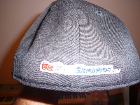 1988 Ford Bronco - Baseball cap with embroidered text 'Go Bronco' and '.com' visible.