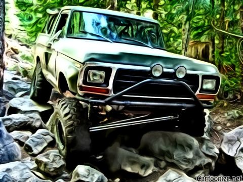 1989 Ford Bronco - This modified Ford Bronco navigates a rocky path, its off-road capabilities.
