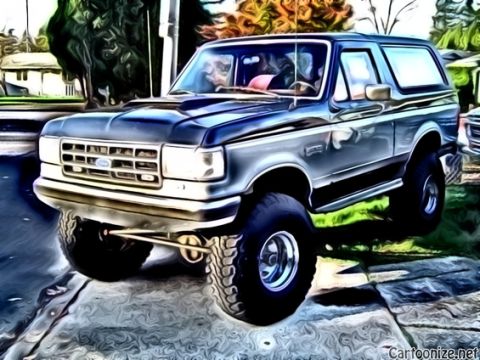 1989 Ford Bronco - A lifted Ford Bronco is shown from a three-quarter front angle, parked on a driveway.