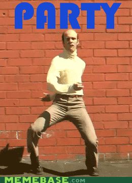 2000 Mercury Grand Marquis - A man performs a dance in front of a brick wall, with the word PARTY displayed prominently overhead.