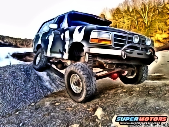 1995 Ford Bronco with custom camouflage paint climbing a rocky incline