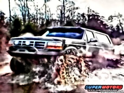 1995 Ford Bronco - This 1995 Ford Bronco is shown navigating a muddy trail with water splashing around its tires.