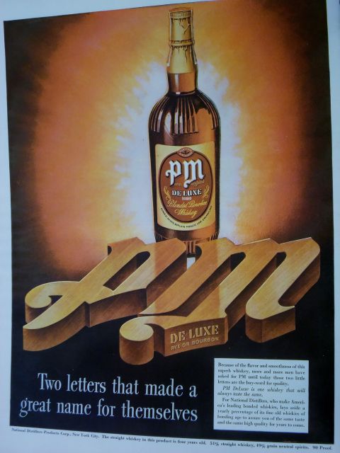 2000 Mercury Grand Marquis - Advertisement for PM De Luxe Blended Bourbon Whiskey, large wooden letters spelling out 'PM'.