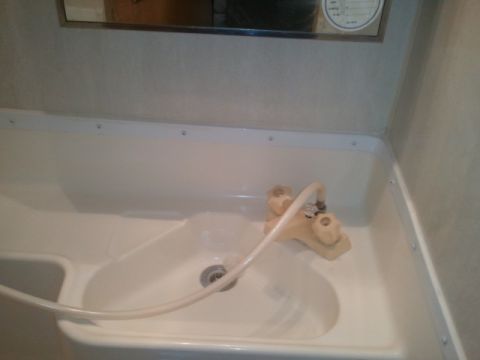 1967 Ford Mustang - Interior view of a sink and faucet assembly within an RV.