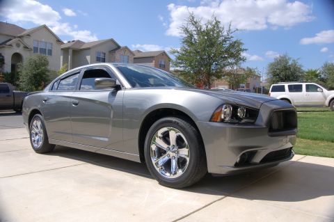 2012 Dodge Charger - A gray 2011 Dodge Charger is parked in front of a suburban house.