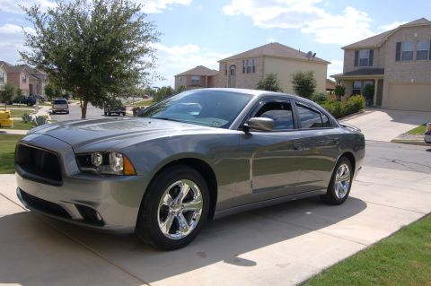 2012 Dodge Charger - Gray Dodge Charger parked in a suburban driveway on a sunny day.