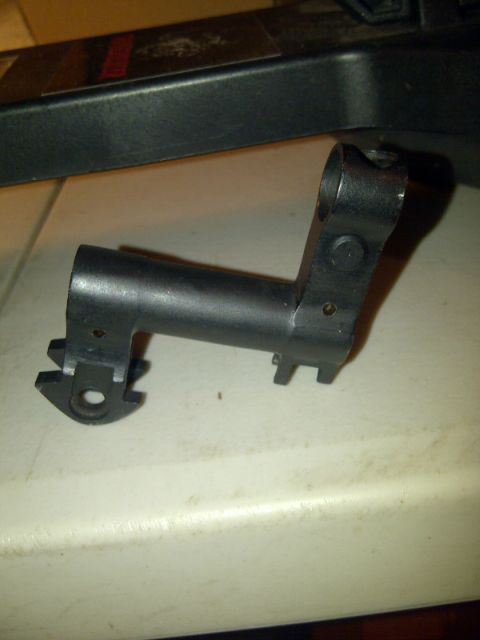 1989 Ford Bronco - This is a close-up view of a metal component, likely a part from a firearm.