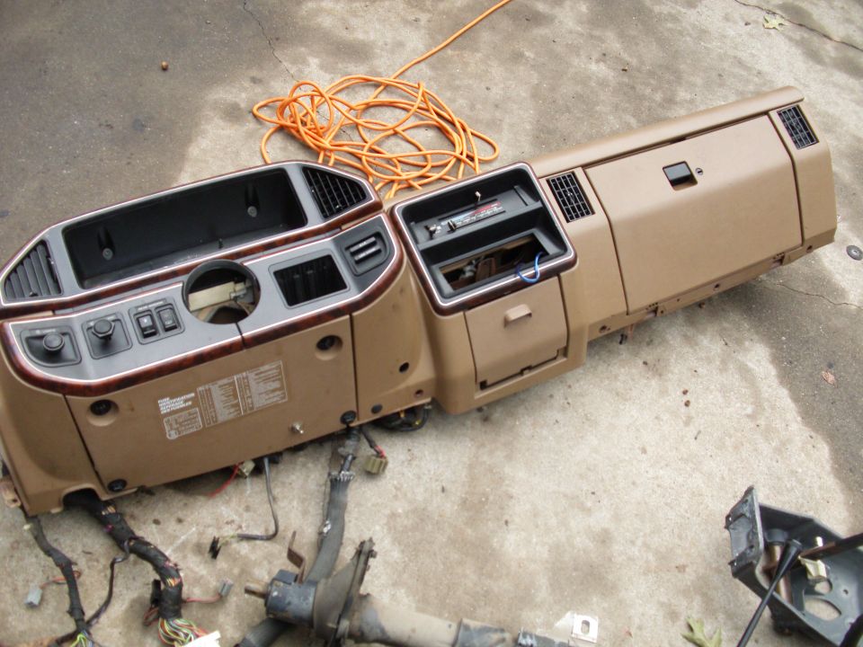 Not as hard as you would think it is to get the whole dash off in one piece. The connectors on the other hand are just your typical PITA ford plugs...

1. I removed both side trim peices around the door jamb.. Then removed the fuse cover at the bottom.

2. remove the left plastic lower covering (where the headlamp switch is) 

3. removed one screw and removed the right side lower cover (where the 4x4 buttons are)

4. release the steering column knuckle in the engine bay with one bolt

5. removed the two bolts holding the steering wheel column up.

6. i slowly dropped the steering wheel removing all the electric connections & the rim of the wheel sat on the seat.

7. i disconnect the parking brake with 3 bolts.

8. i undid all the electrical connecters on the drivers side kick panel carefully

9. I unplugged all the electrical connecters on the right side kick panel

10. I removed the two bolts under the dash at attached to the firewall.

11. I removed the two bolts on the right side of the dash edge then removed the two bolts on the left side of the dash.

12. then finally removed the four screws across the top that are attached to the firewall.

13. Then i slowly (yeah right) dropped the whole dash on the floor. 


14. i unplugged the rest of the wiring harness and vacuum lines.. I did get impatient and just went and snapped one ground wire that was attached to the firewall but over all it was out and i was happy!