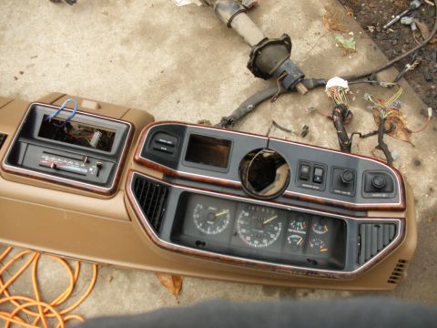 1988 Ford Bronco - Dashboard assembly removed from a vehicle, showing the instrument cluster and wiring harness.