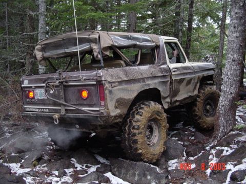 1989 Ford Bronco - This 1978 Ford Bronco navigates a rocky trail with its soft top deployed.