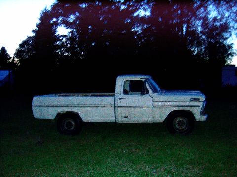 1967 Ford F-250 - This pickup truck appears to be from the early 1970s, with a boxy body style and simple design.