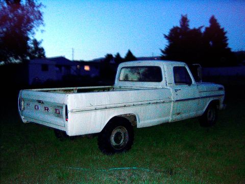 1967 Ford F-250 - This 1967 Ford F-250 pickup truck is seen in a grassy yard at dusk.