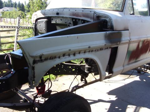 1967 Ford F-250 - Front fender and chassis of a 1967 Ford F-250 undergoing repair work.