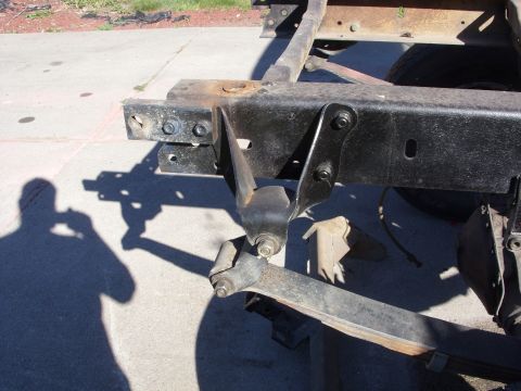 1967 Ford F-250 - Frame and suspension parts of a truck are visible in this close-up shot.