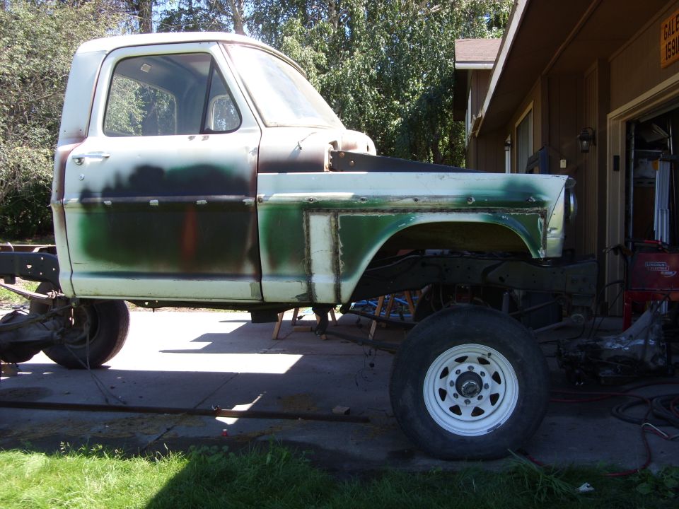 1967 Ford F-250 cab and chassis, primer and green paint, undergoing restoration, side view