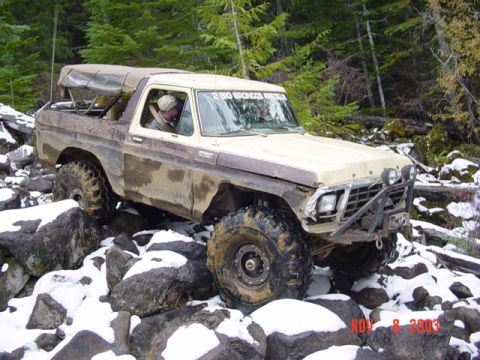 1989 Ford Bronco - This modified Ford Bronco is shown off-roading in a rocky, snowy environment. The date "NOV 8 2003" is visible.