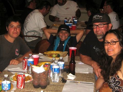 1996 Ford Bronco - People gathered around a table for a meal, with drinks and snacks laid out.