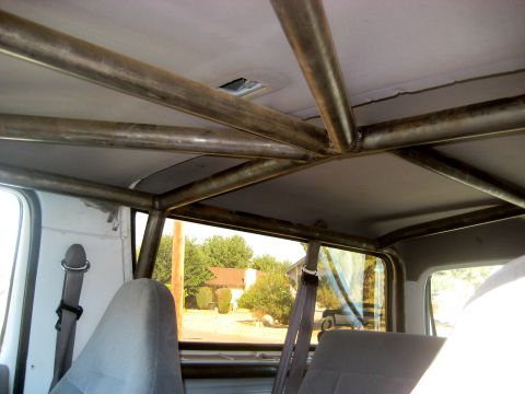 1996 Ford Bronco - Interior view of a 1996 Ford Bronco showing a custom metal roll cage installed.
