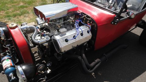 1964 Ford Fairlane - Custom hot rod engine bay features a V8 engine with chrome details and black exhaust pipes.