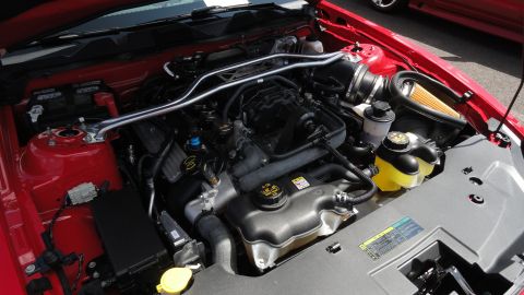 1964 Ford Fairlane - Engine bay of a 2010 Ford Mustang, showing the V8 engine and related components.