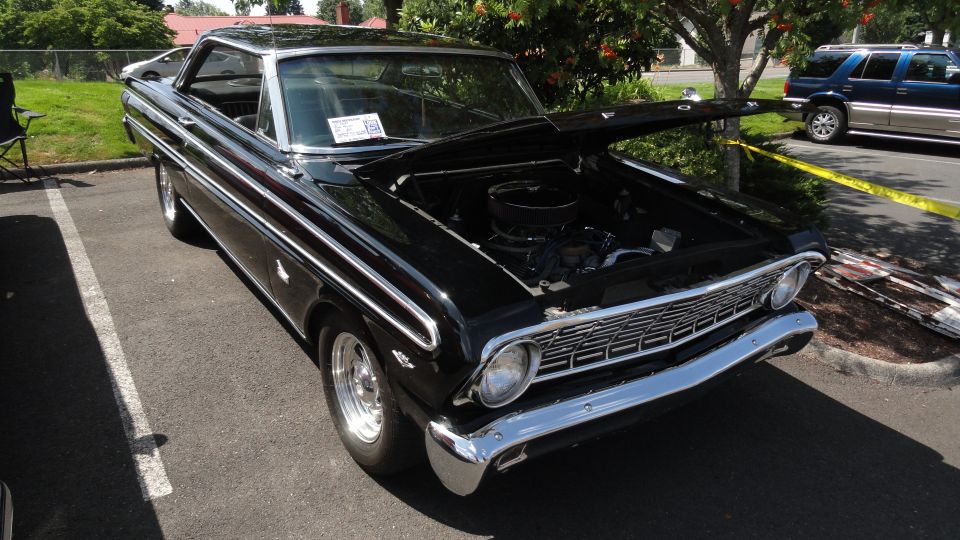 1964 Ford Fairlane with hood open, showing engine bay