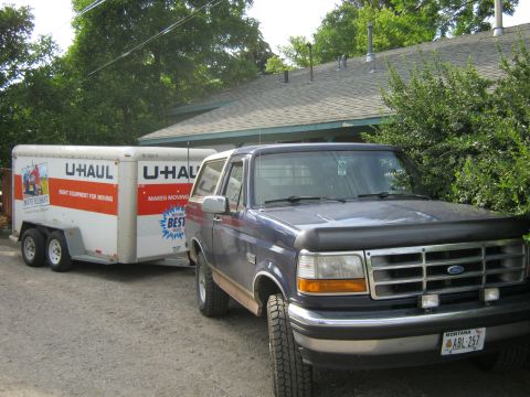 1994 Ford Bronco - This blue 1994 Ford Bronco is seen towing a U-Haul trailer, likely for a move.