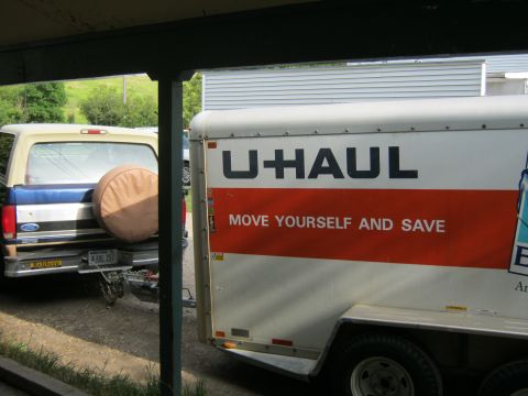 1994 Ford Bronco - Ford Bronco from the mid-90s is parked beside a U-Haul trailer.