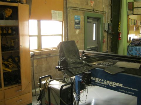 1994 Ford Bronco - EASY LOADER CNC cutting table with computer setup in a workshop environment.