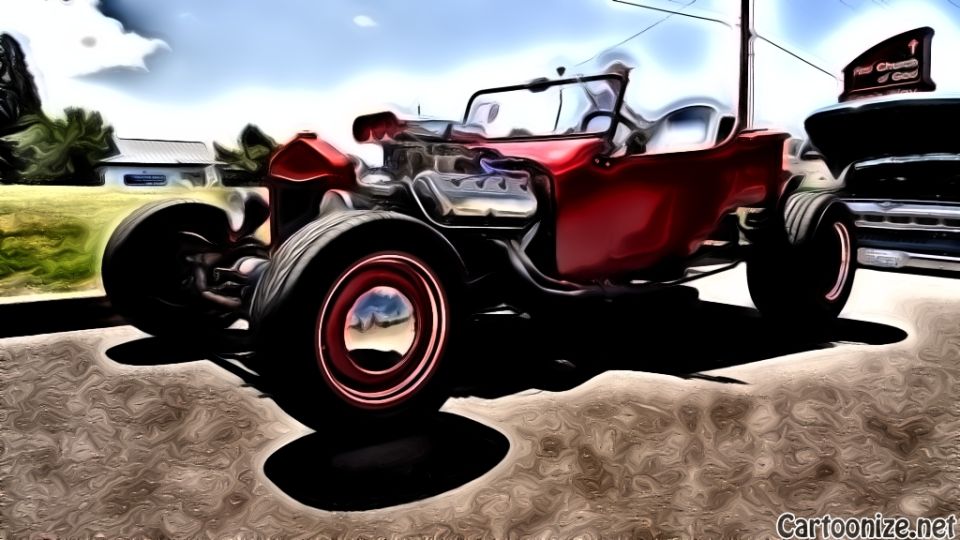 Red hot rod with exposed engine and wide tires parked next to another vehicle